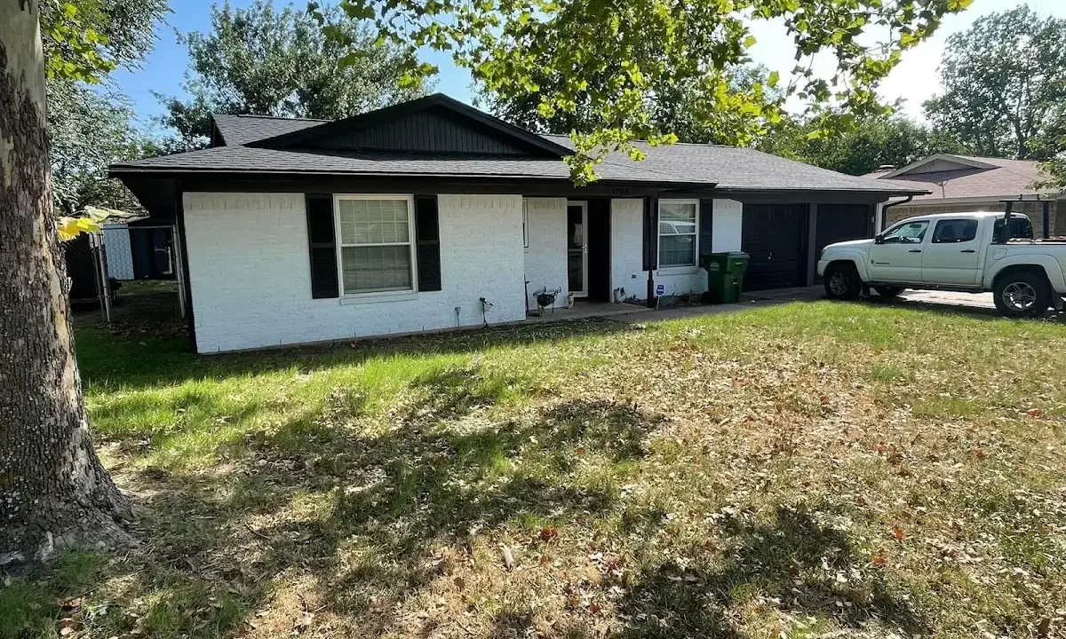 Professional roofing crew working on a residential roof in Picnic Point